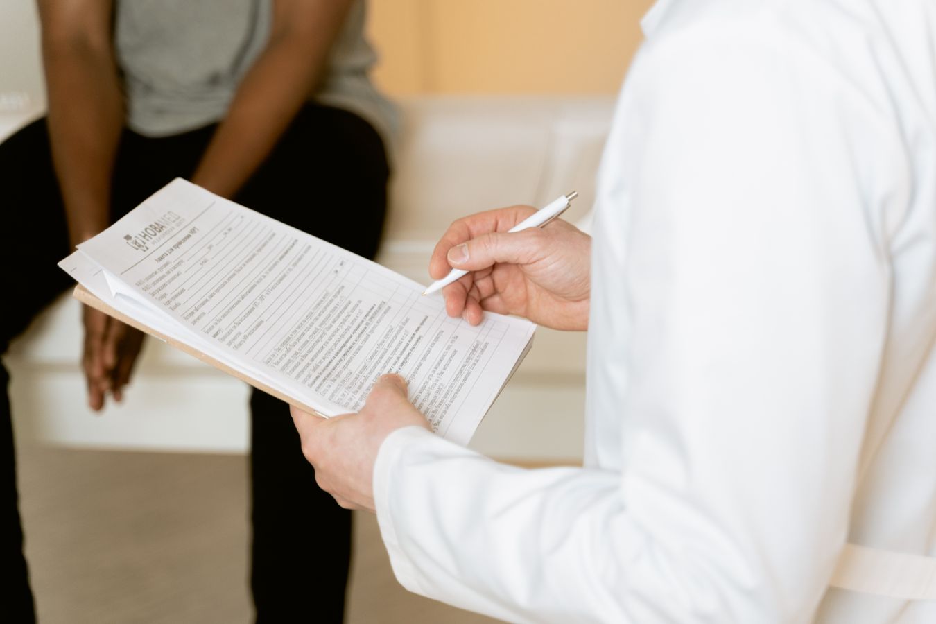medical malpractice attorney reviewing hospital records with patient